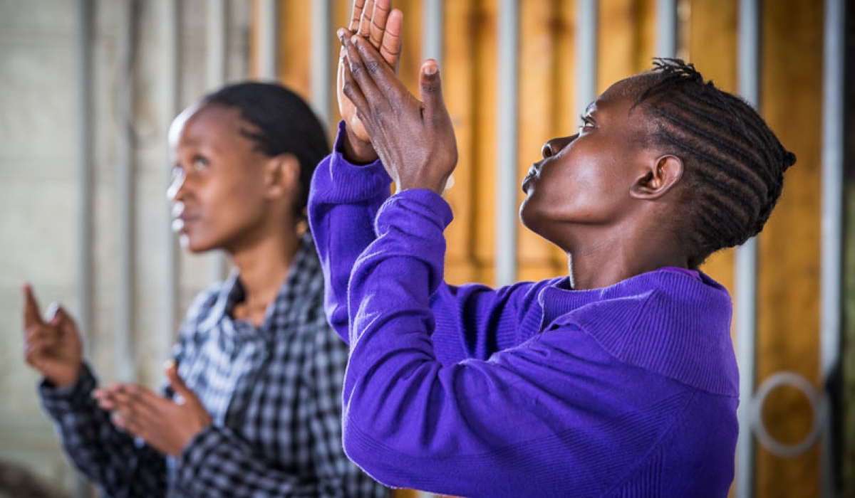 A church member uses sign language to communicate with deaf congregants during a service. Net Photo
