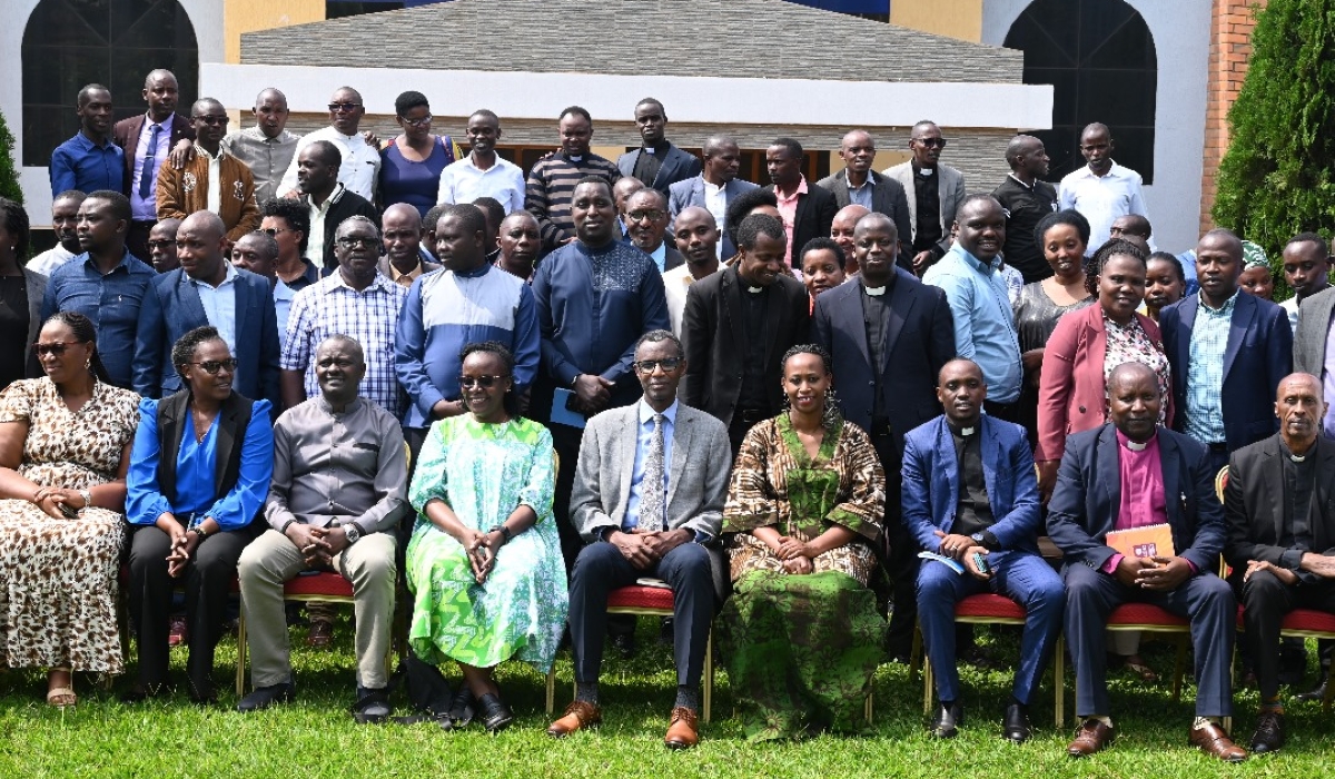 Postgraduate theology candidates, World Vision Rwanda staff, and government officials gather for a group photo at the East African Christian College in Kigali on Friday, November 28. Photos by Craish Bahizi.