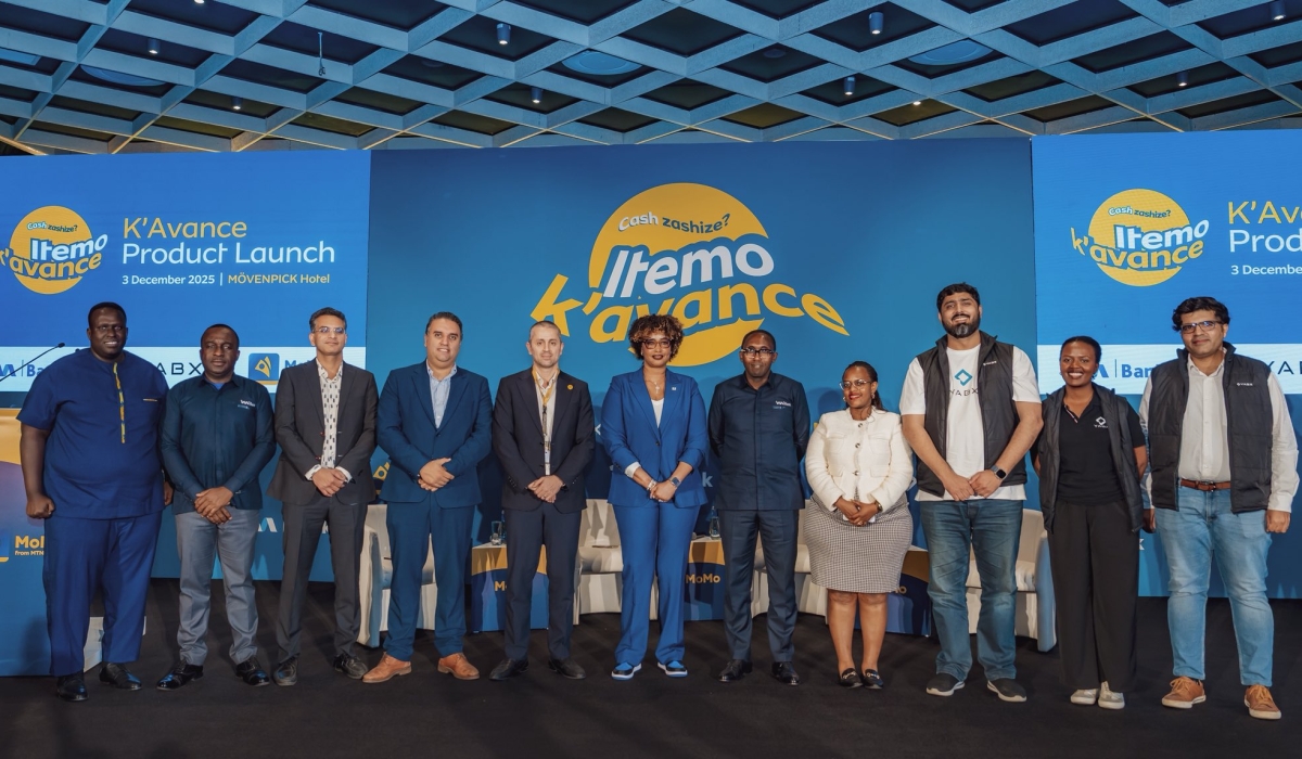 Attendees pose for a group photo at the launch of “K’avance,” an innovative overdraft service that allows users to complete essential mobile money transactions even when their wallet balance is low, on December 3. Courtesy