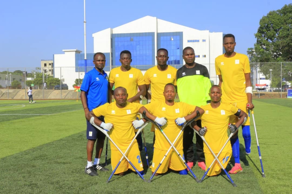 Front row Gatete (R) plays for Rwanda Amputee Football team.