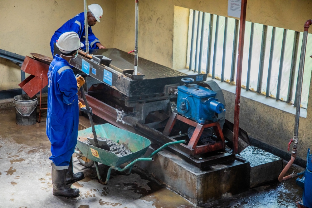 Workers operate mineral testing equipment at a mining facility, preparing samples and monitoring analysis results on December 4. Photo by Craish Bahizi