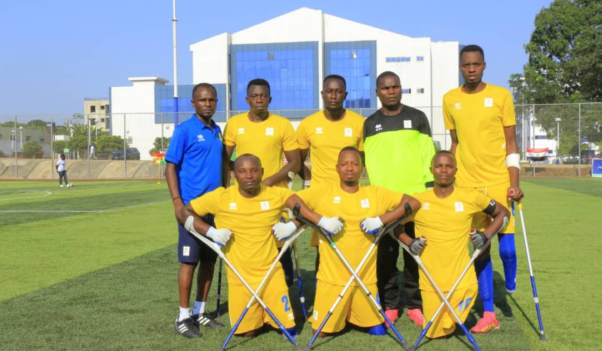 Front row Gatete (R) plays for Rwanda Amputee Football team.