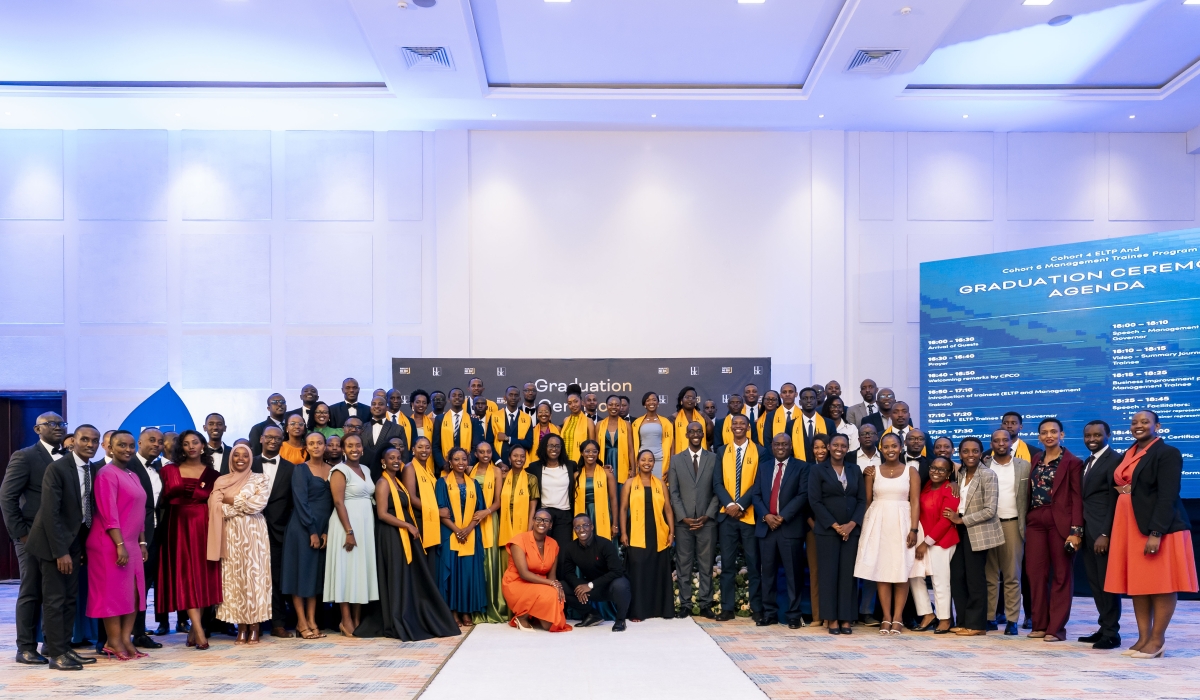 Bank of Kigali CEO, Diane Karusisi, poses with staff and graduates for a group photo during the ceremony in Kigali on December 4. 