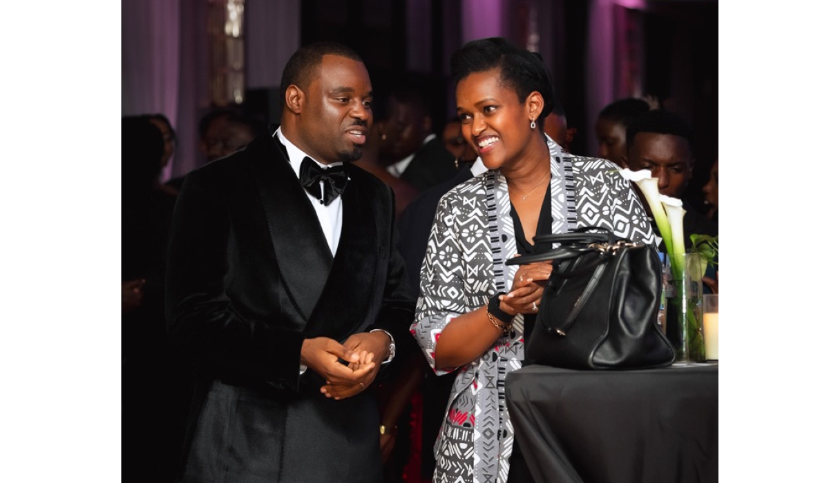 Minister of State for Youth and Arts Sandrine Umutoni (R) shares a light moment with Zacu TV CEO Wilson Misago at a gala held December 5. Photo courtesy