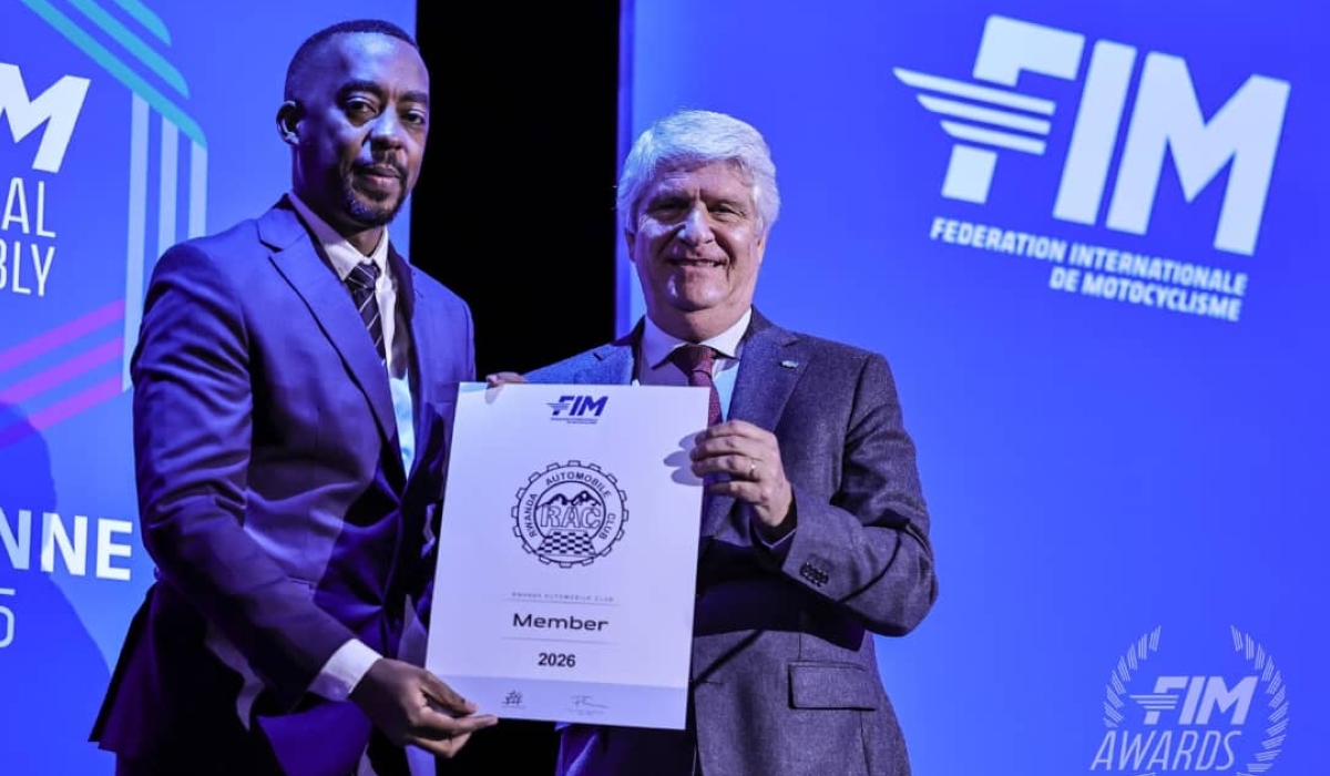 Rwanda Automobile Club president Christian Gakwaya (L) was present in Lausanne as FIM president Jorge Viegas (R) welcomed Rwanda into the global motorcycling family. Photo courtesy 