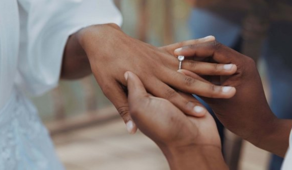 A groom places a ring on his bride’s hand during a wedding ceremony, while 2,674 divorce cases were recorded in Rwanda in 20242025. Courtesy
