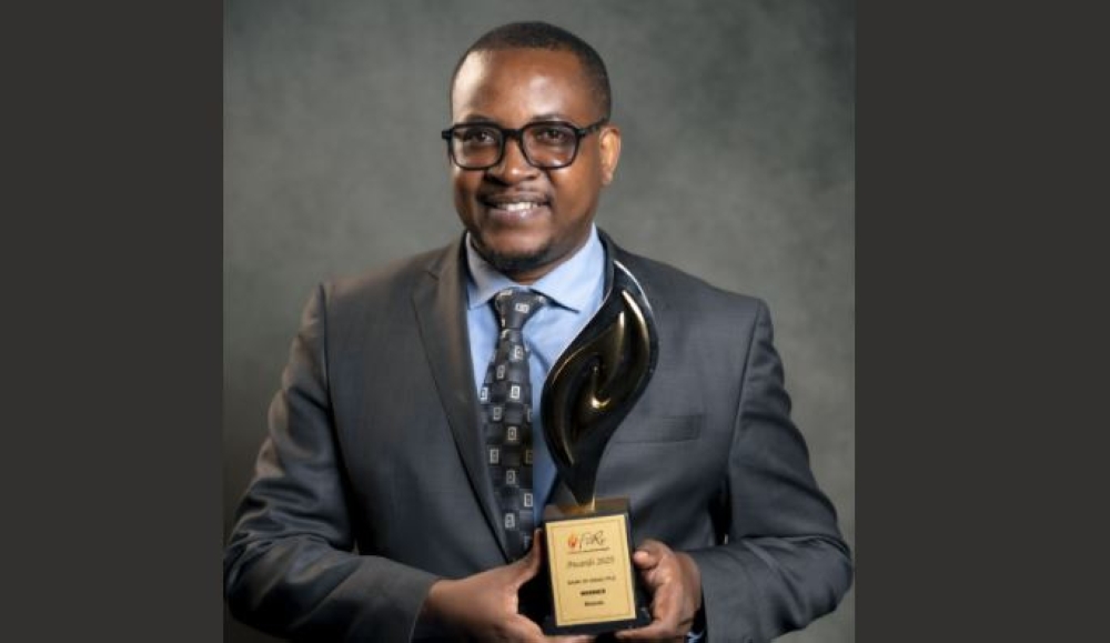 Jean Bosco Rukundo, Head of Financial Reporting at Bank of Kigali, poses with the award.