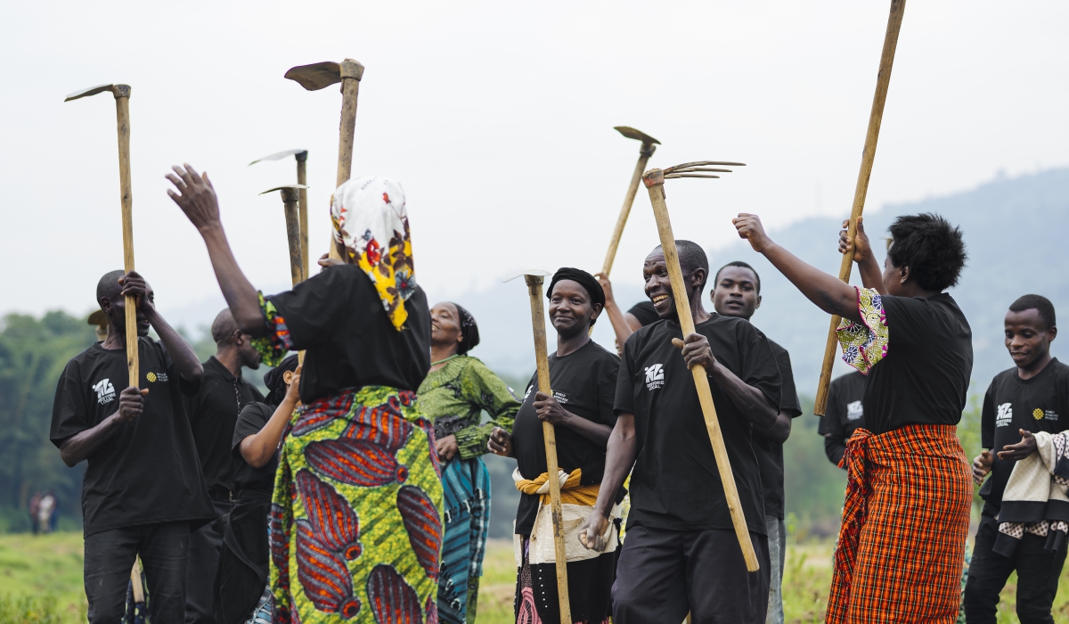 Farmers from Shyira Sector in Nyabihu District celebrate after planting 4,000 indigenous tree species in the buffer zone of the Mukungwa River.