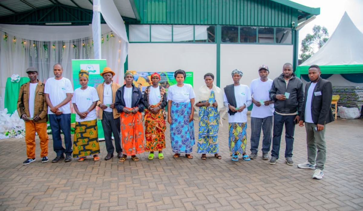 Farmers and tea pluckers pose for a group photo during celebrations at Rubaya Tea Factory on December 6. Photo by Craish Bahizi.