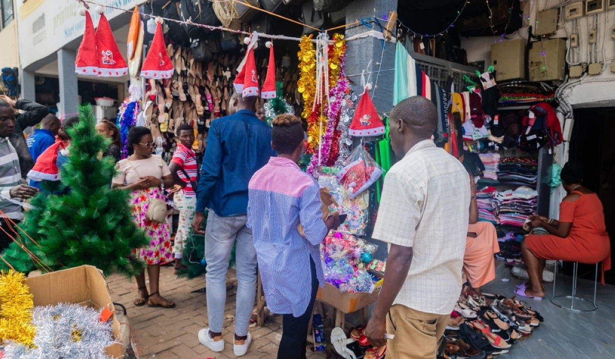   Clients shop for various Christmas items in Kigali. Many people tend to overspend on food, gifts, outings, travel, and parties without tracking expenses, often leaving them in debt after the celebrations. Photo by Craish Bahizi   