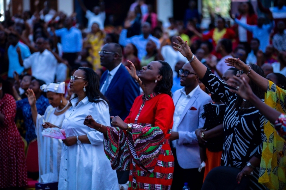 Believers during a praise and worship session at Evangelical Restoration Church in Kigali on December 25. Photo by Emmanuel Dushimimana