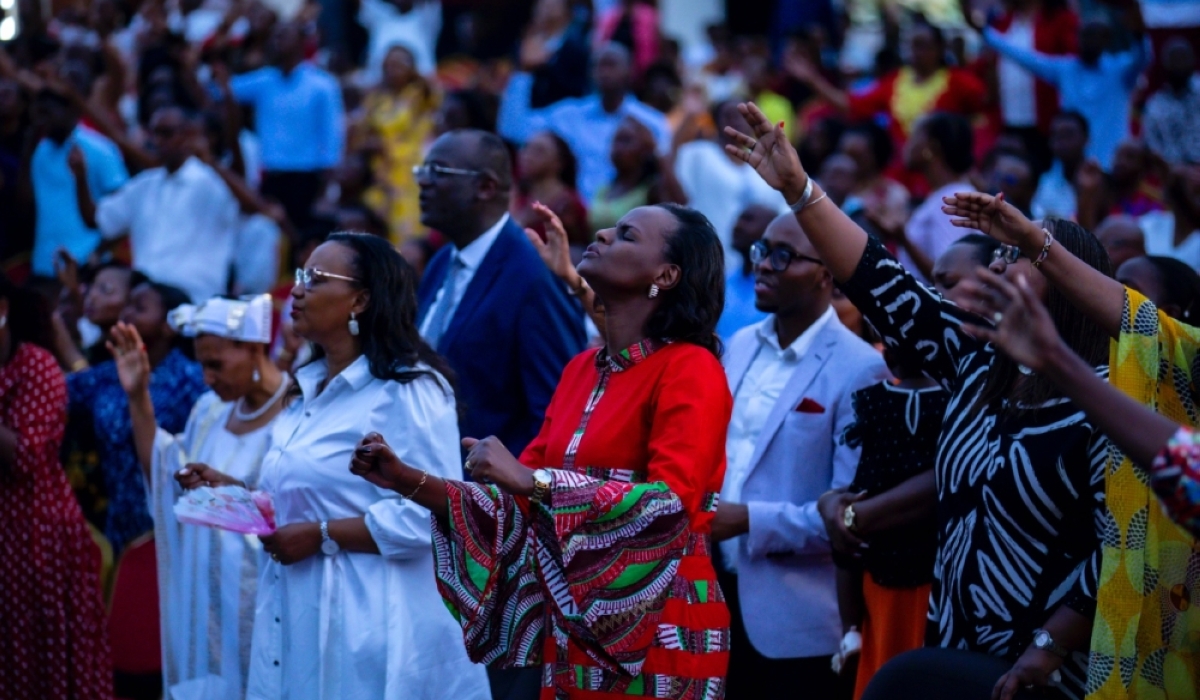 Believers during a praise and worship session at Evangelical Restoration Church in Kigali on December 25. Photo by Emmanuel Dushimimana