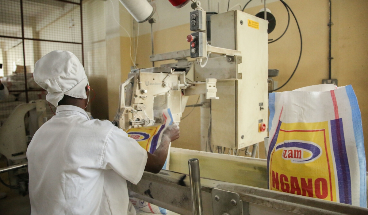 A worker seals wheat flour packages at Azam Industries in Kigali on October 27. Rwanda relies on Russia, Ukraine, the USA, Australia, Brazil, and other countries for wheat imports. Photo courtesy.