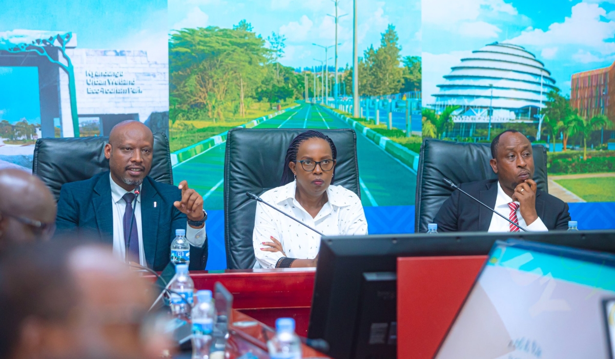 Education ministry permanent secretary Charles Karakye addresses a meeting on education initiatives on December 10, while Kigali’s vice mayor for socio-economic affairs Martine Urujeni, and Gasabo District Executive Administrator Bernard Bayasese look on. Photos: Courtesy