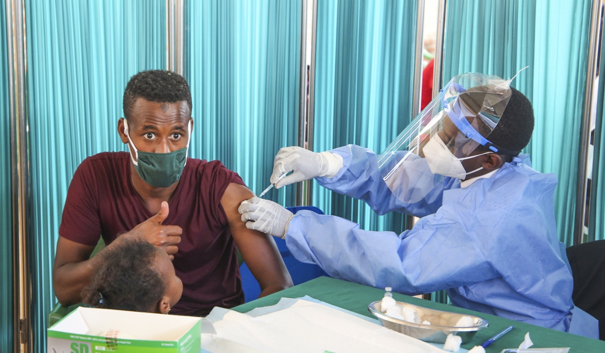 A medic administers a COVID-19 vaccine in Bugesera on March 10, 2021. Photo by Craish Bahizi