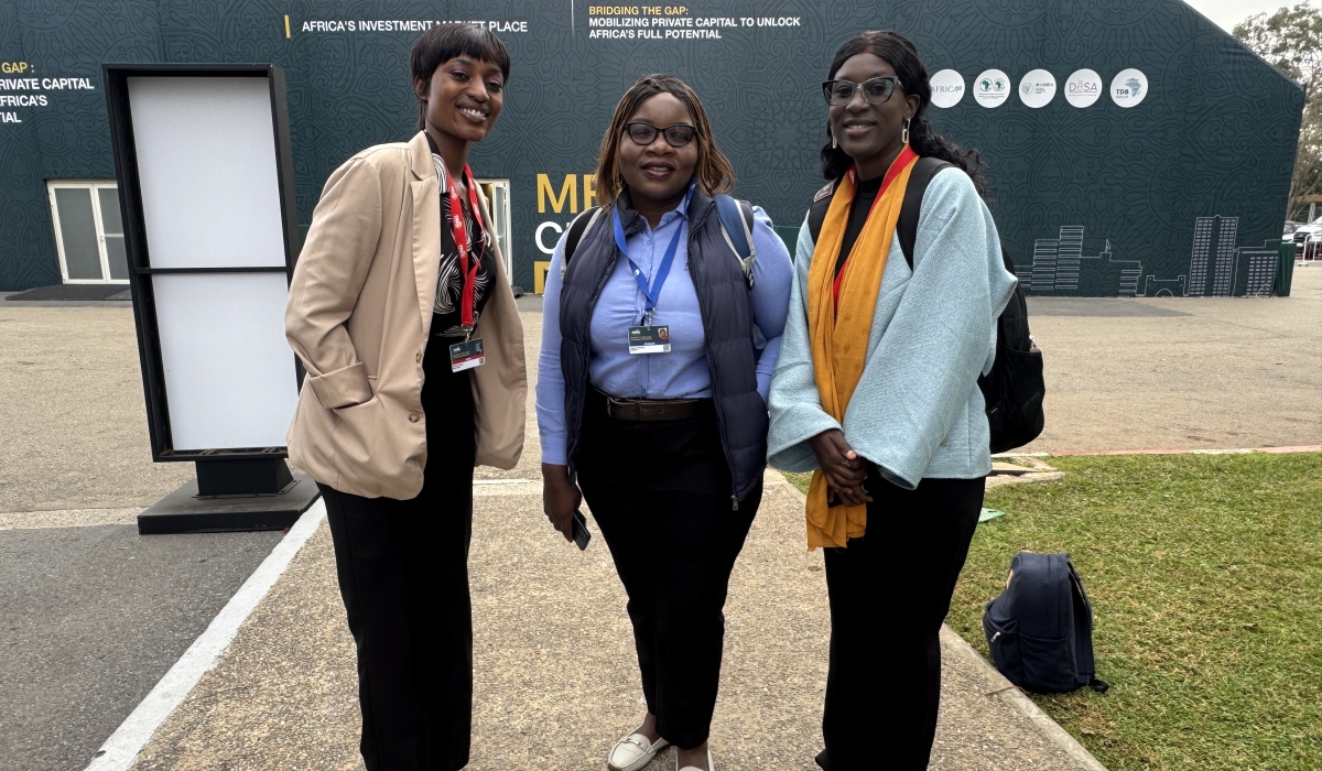 The writer poses with her new friends, Melody Chikono from Zimbabwe, and Hawa Ba from Mauritania, during the trip in November.