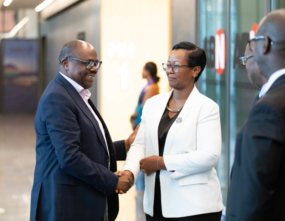 Prime Minister Justin Nsengimana interacts with the Chairperson of the Private Sector Federation (PSF), Jeanne Françoise Mubiligi at the ceremony.