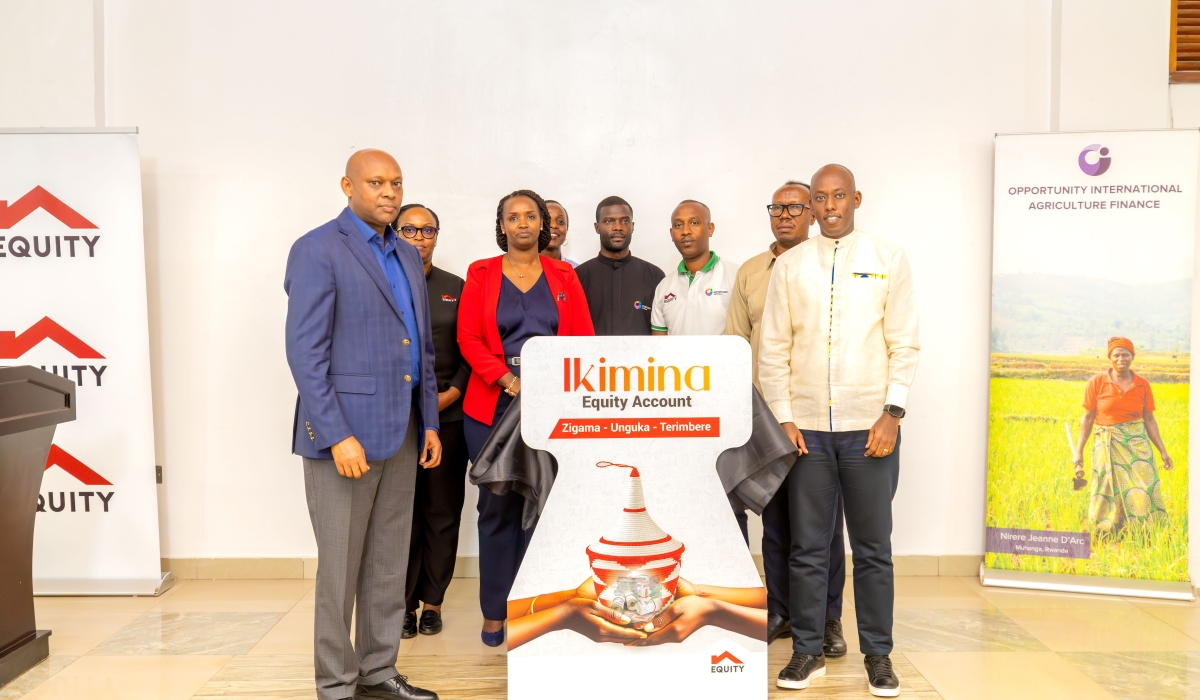 Officials pose for a photo at the launch of the Equity Ikimina Account  in Huye District on Friday, December 12