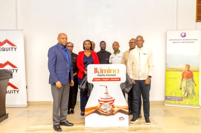 Officials pose for a photo at the launch of the Equity Ikimina Account  in Huye District on Friday, December 12