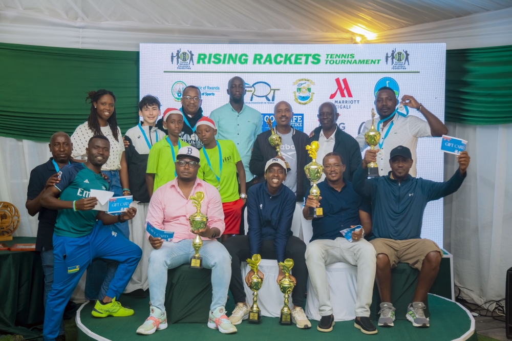 Winners of Rising Rackets Tennis Tournament pose for a group photo.