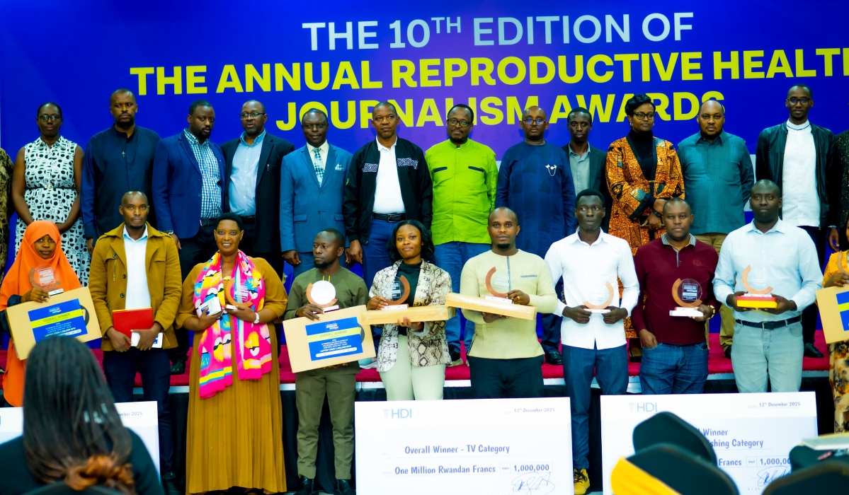 Officials and award winners pose for a group photo  at the 10th edition of the Annual Reproductive Health Journalism Awards, organised by the Health Development Initiative (HDI) on December 12. Photos by Craish Bahizi