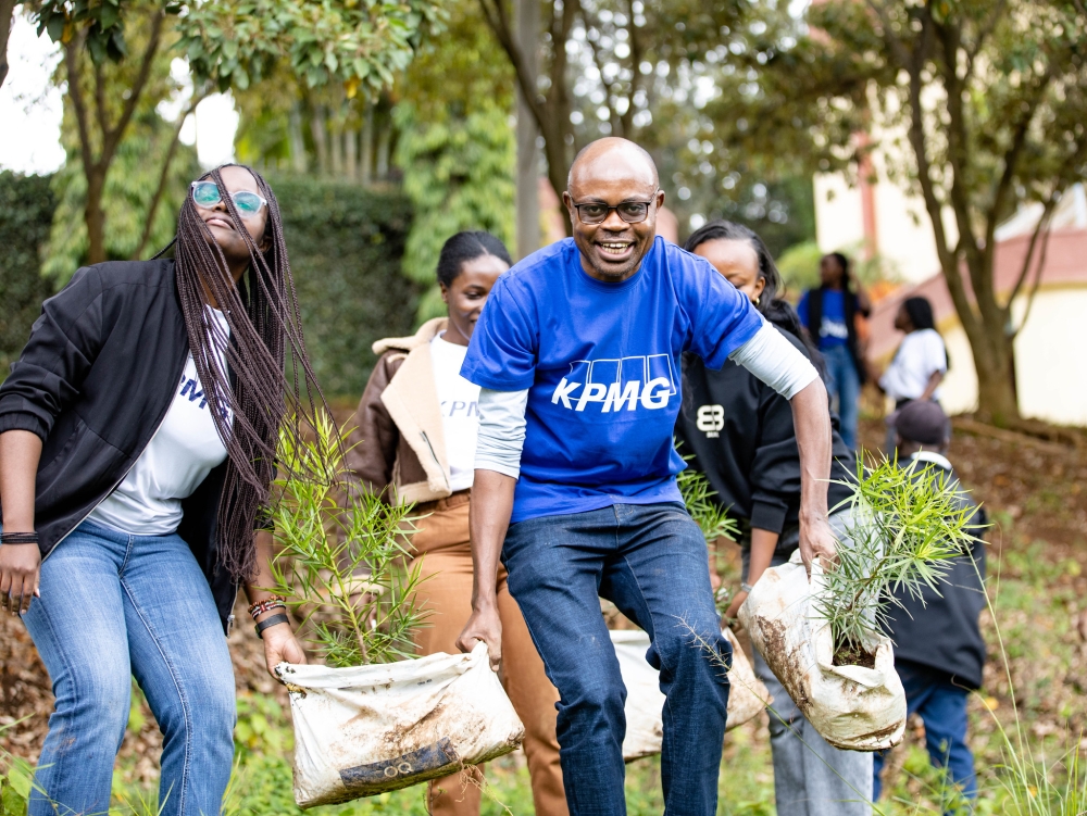 KPMG Rwanda, a subsidiary of KPMG International, strengthened Kigali’s green initiative by engaging in a tree planting activity in Kamukina Cell, Kimihurura on Friday, December 12. Photos by Dan Gatsinzi