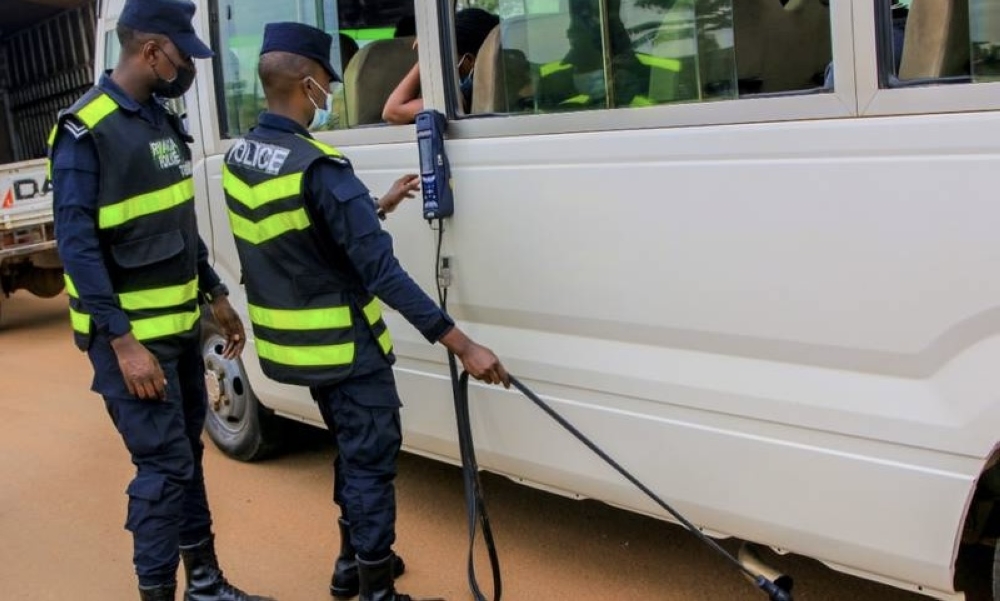 Rwanda National Police officers inspect vehicle air pollution in Kigali. File