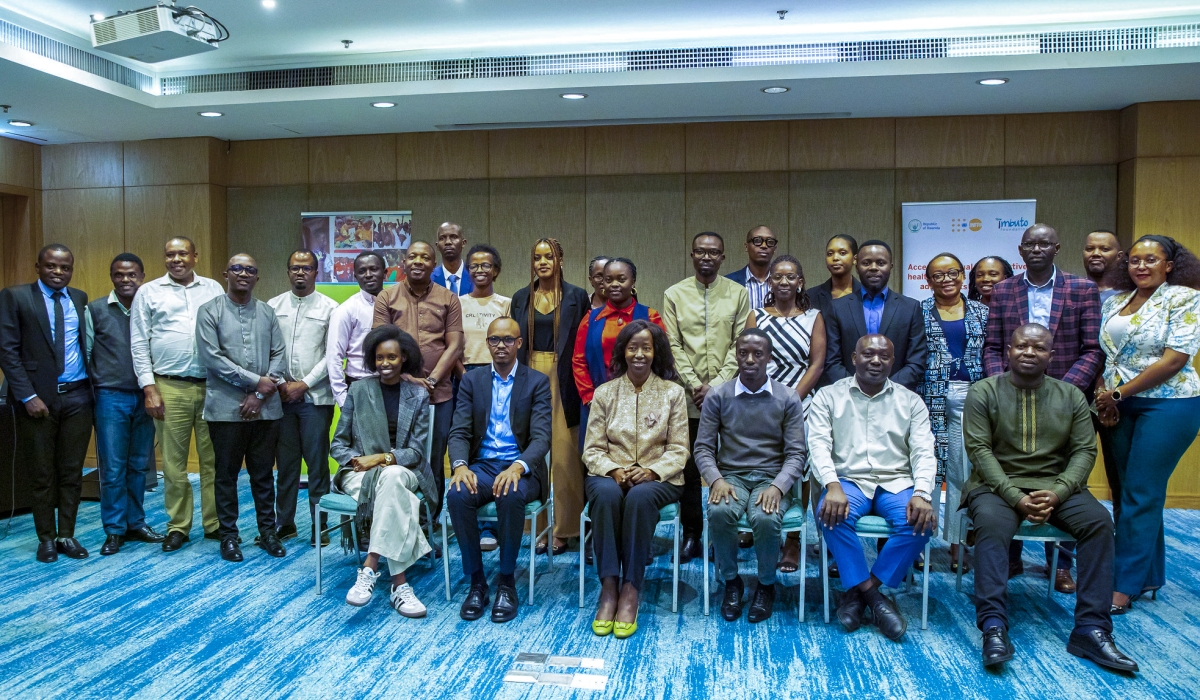 Participants pose for a group photo at a workshop in Kigali  on December 16