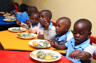 Children eat nutritious food at ECDC in Nyamasheke District through “GIKURIRO KURI BOSE” program. Photo by Craish Bahizi