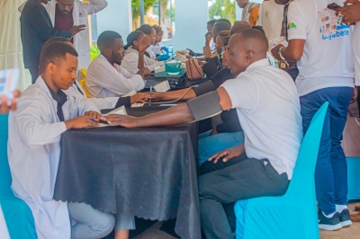 Residents undergo the Community-based screening for hypertension and NCDs at Kigali Car Free Day mass sports. File
