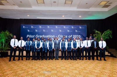 Officials pose for a group photo with the newly graduated 18 pilots of the sixth cohort from Akagera Aviation Flying School (AAFS).