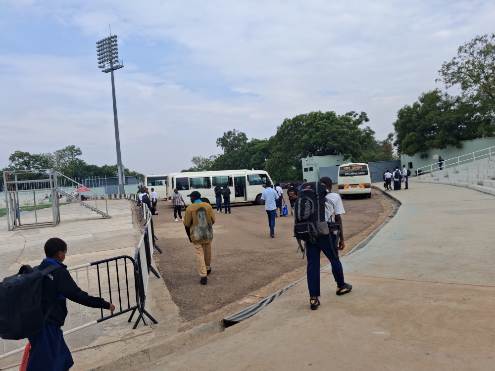 Students gather at Kigali Pele Stadium as they wait to board buses to their home districts ahead of the festive season holidays.
