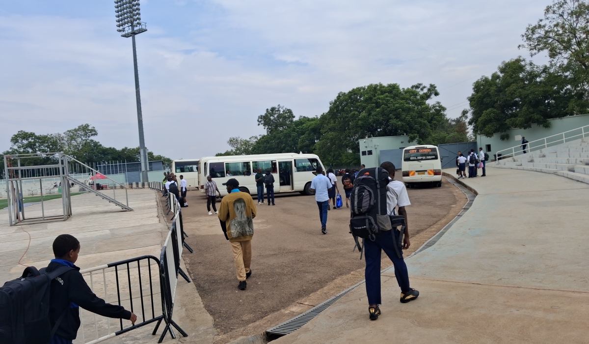 Students gather at Kigali Pele Stadium as they wait to board buses to their home districts ahead of the festive season holidays.