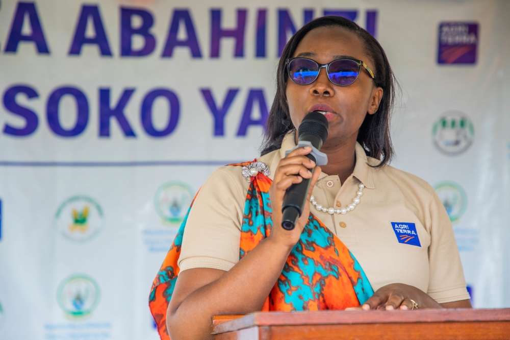 Agriterra’s Acting Country Representative, Marine Umukunzi, addresses farmers at the event. Photos by Craish BAHIZI