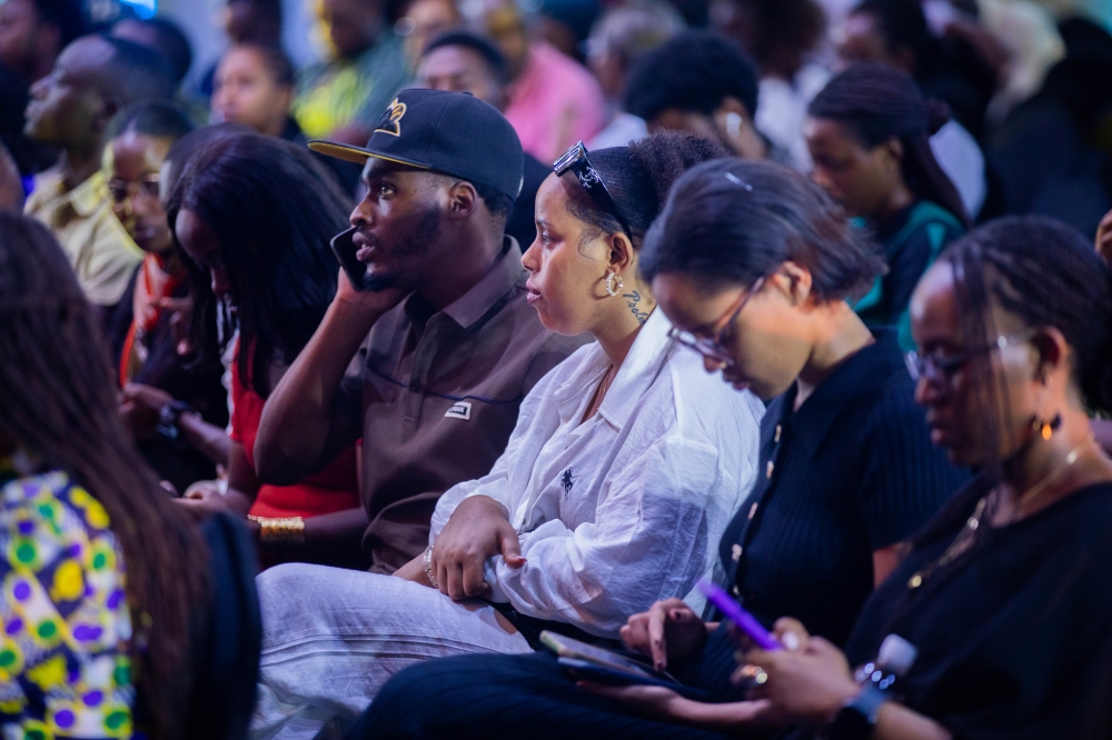 Delegates follow the proceeding of the event.