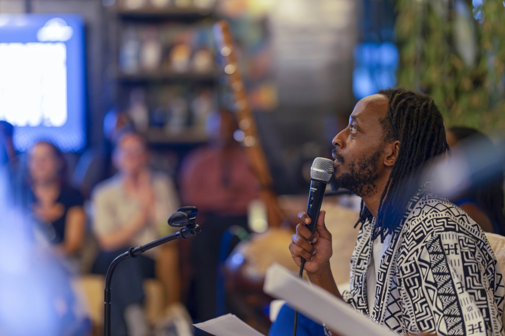 Michael Sengazi speaks to the audience during the presentation of the play