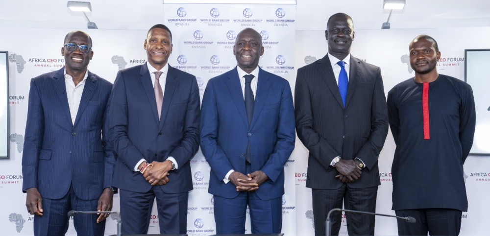 Officials pose for a photo at the signing ceremony on the sidelines of Africa CEO Forum in Kigali.