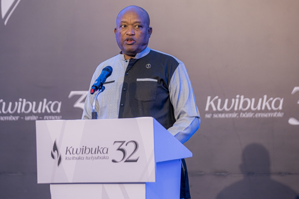 Genocide researcher and historian Tom Ndahiro speaks to the mourners at the event.