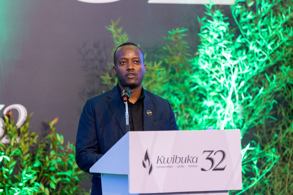 Rwanda Social Security Board Chief Executive Officer, Regis Rugemanshuro, addresses mourners during the commemoration of 19 former employees of Caisse Sociale du Rwanda. File