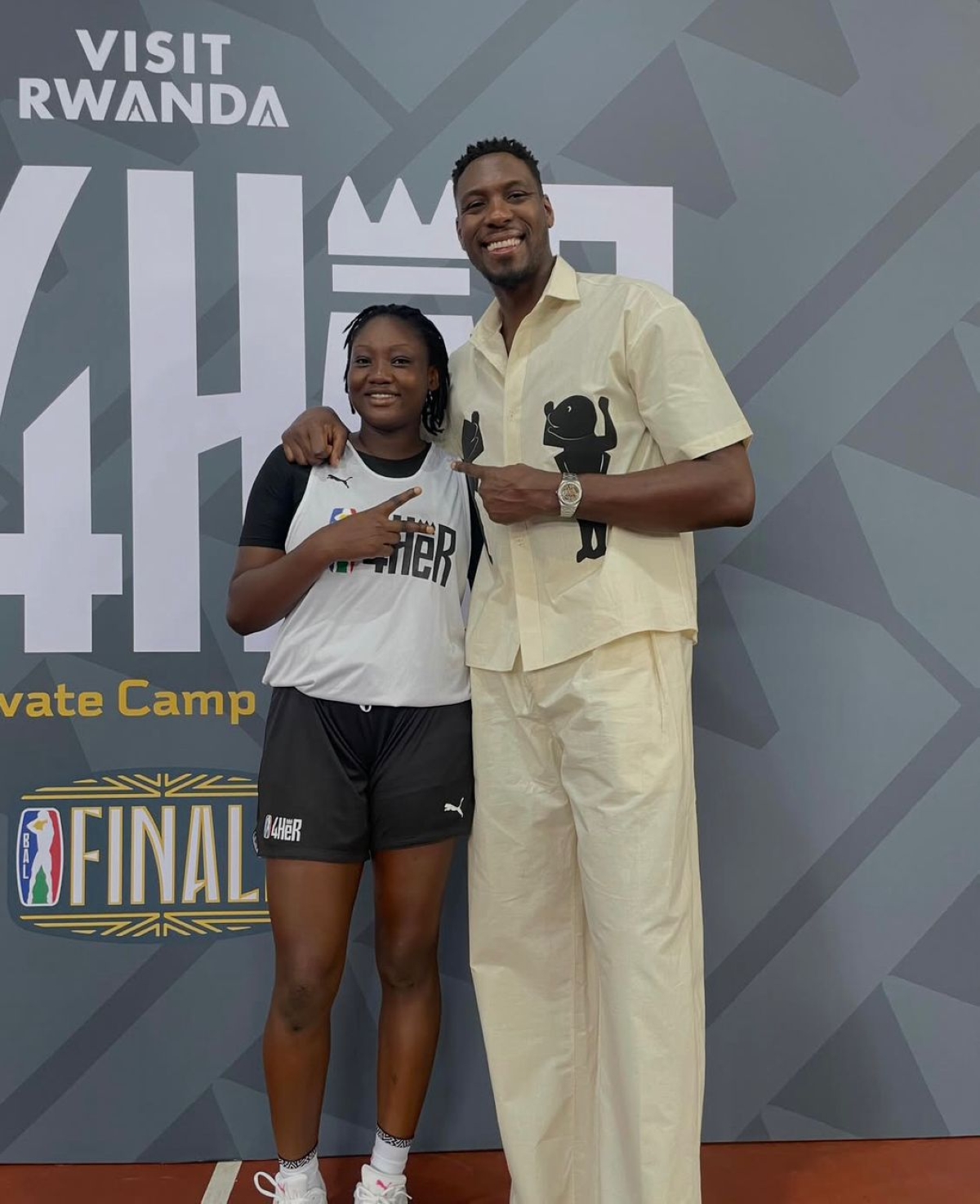 Ian Mahinmi (right) former NBA player and of BAL ambassador poses with a BAL4HER 2026 elevate camp participant in Kigali. courtesy