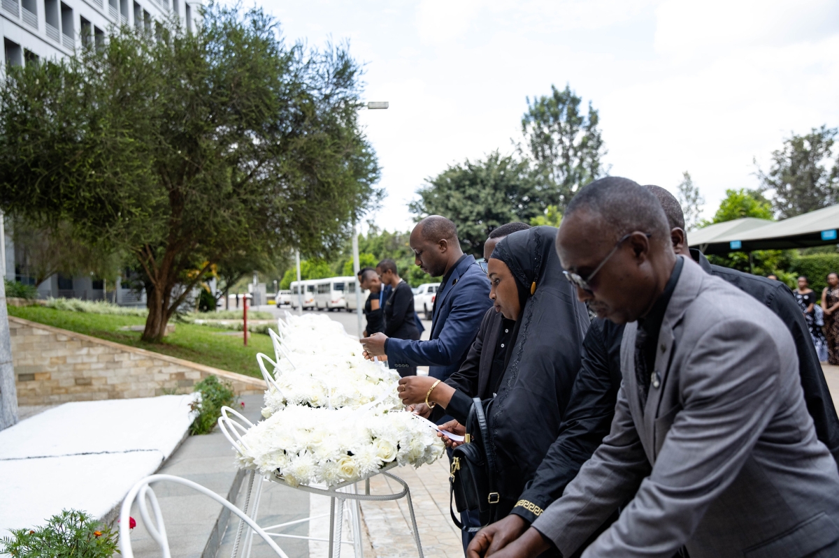 Mourners laying wreaths to pay tribute to the victims during the commemoration event.
