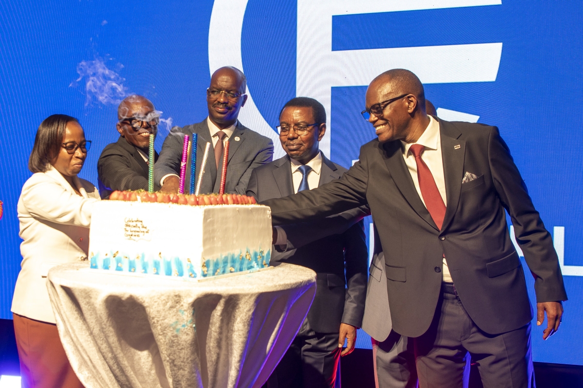 Officials cut a cake to celebrate the launch of CHIC Finance PLC
