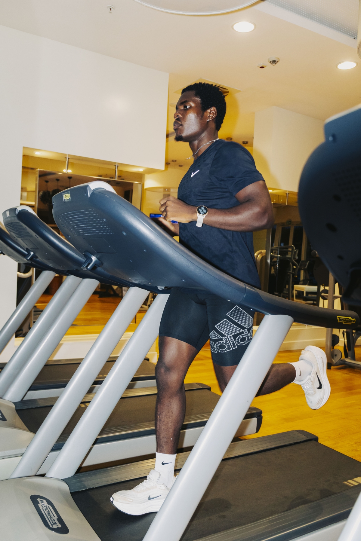 Nigerian digital creator and social media influencer Eniksnuel works out on a treadmill at Radisson Blu Kigali, one of the wellnes amenities offered by the hotel. (courtesy)