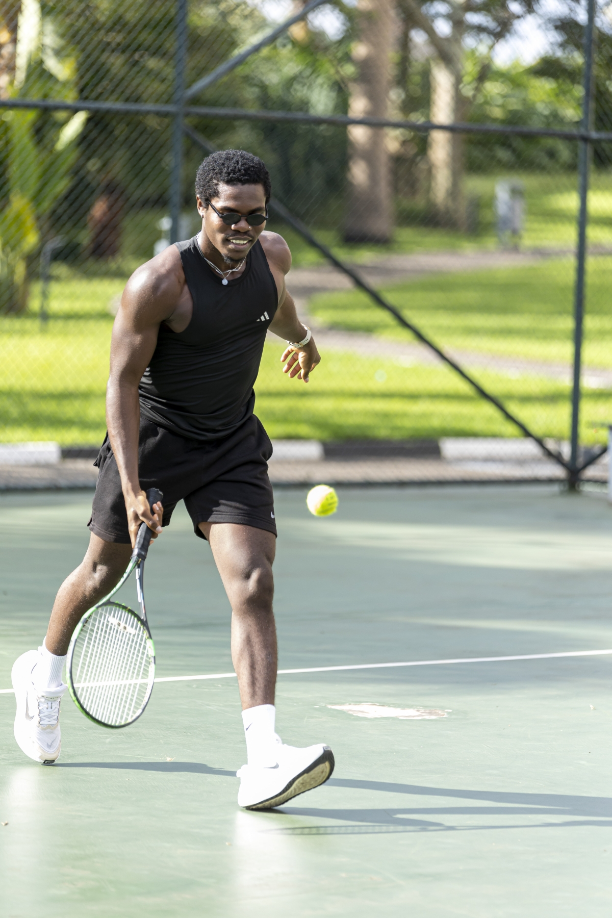 Nigerian digital creator and social media influencer Eniksnuel takes to the tennis court at Radisson Blu Kigali, highlighting the available recreational experiences.(courtesy)