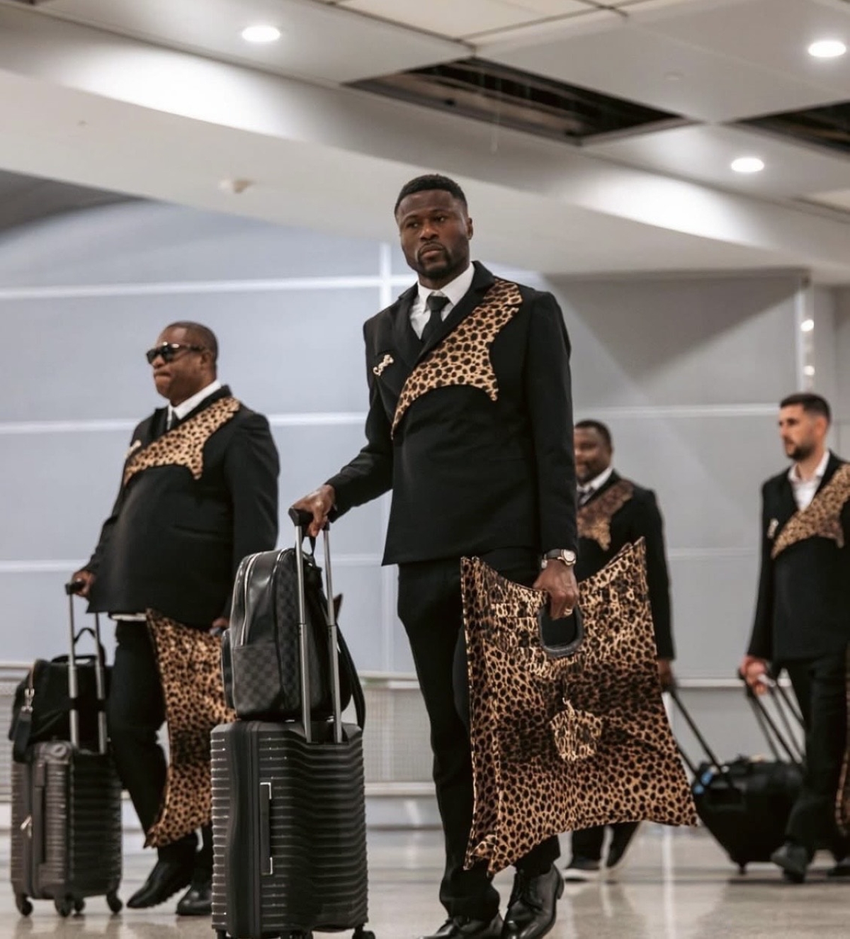 DR Congo players arrived in elegant black suits enhanced with leopard-print details.