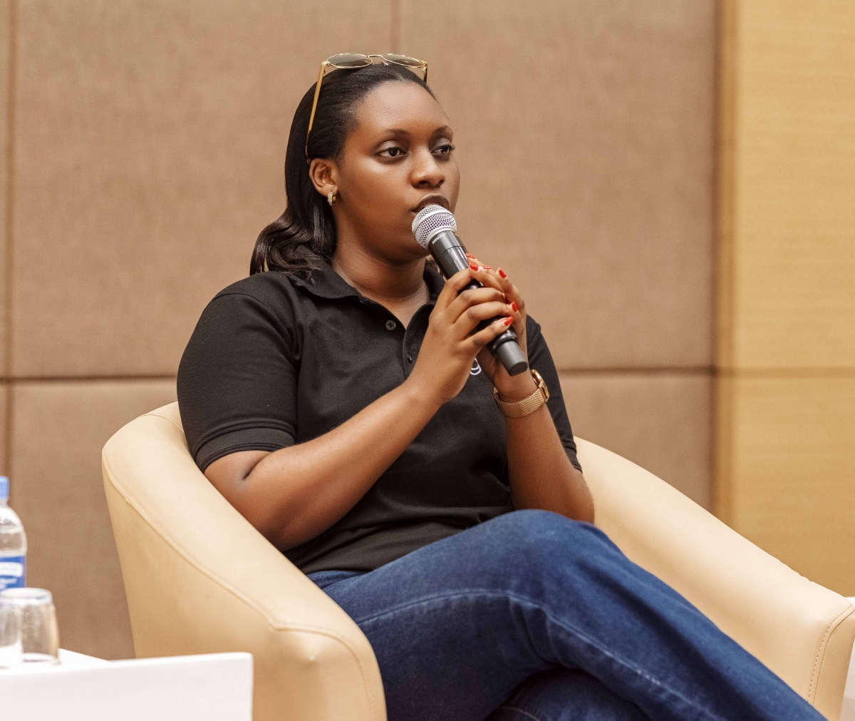 Ines Dushime, Country Lead of GlobX, speaks at the meeting in Kigali.