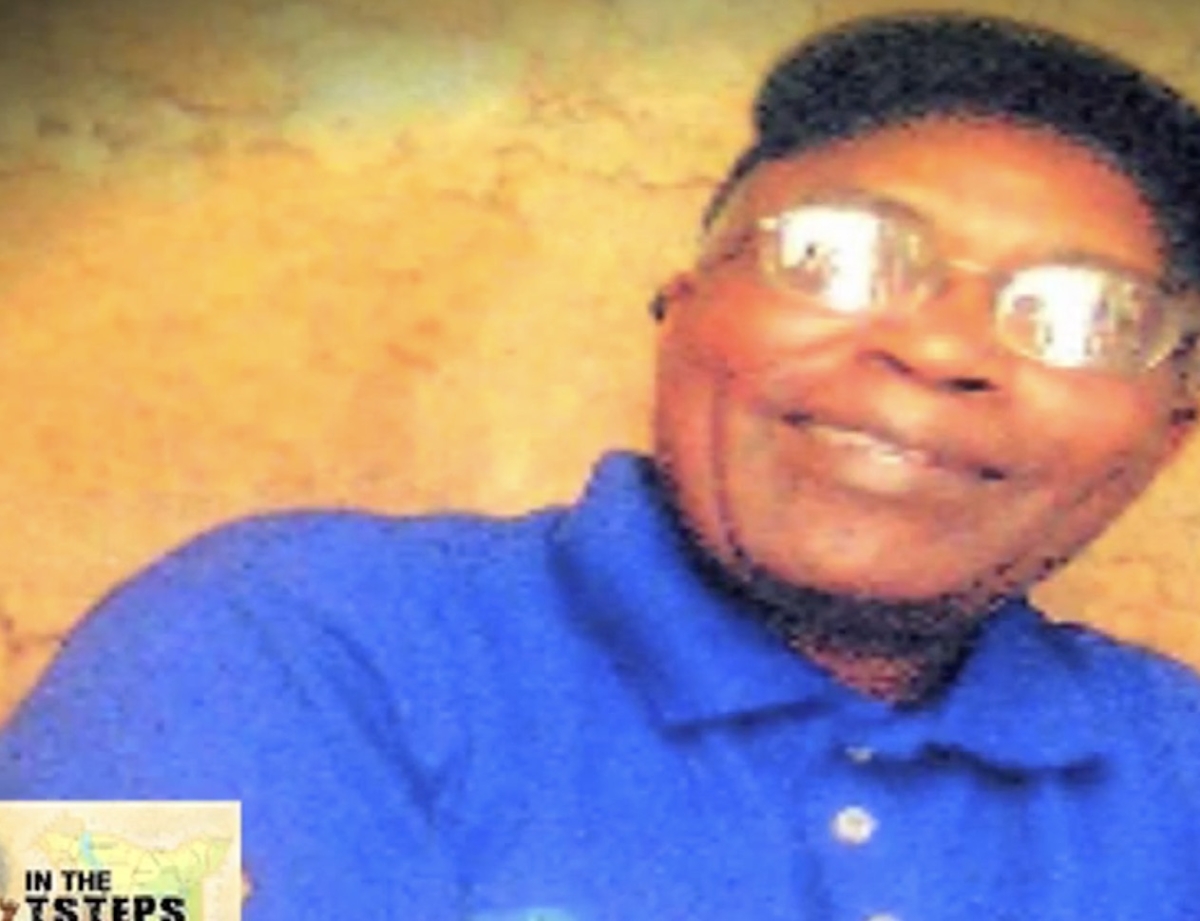 A picture purported to be of Kabuga, secretly taken around 2008 in Nairobi by a member of his protection squad. His shirt bears a Kenyan government coat of arms.