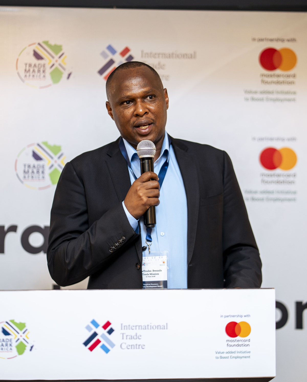 Naphtal Kazoora, the Head of Special Economic Zones (SEZ) and Export Facilitation Department, speaks at the event.