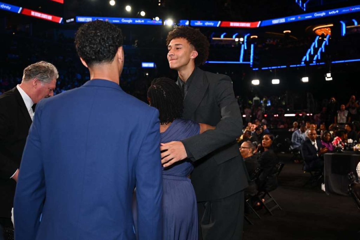 Rwandan-American forward Nate Ament's mother Godelive Mukankuranga congratulates her son after he was selected by the Miami Heat with the 13th overall pick in the 2026 NBA Draft, on Tuesday, June 23.