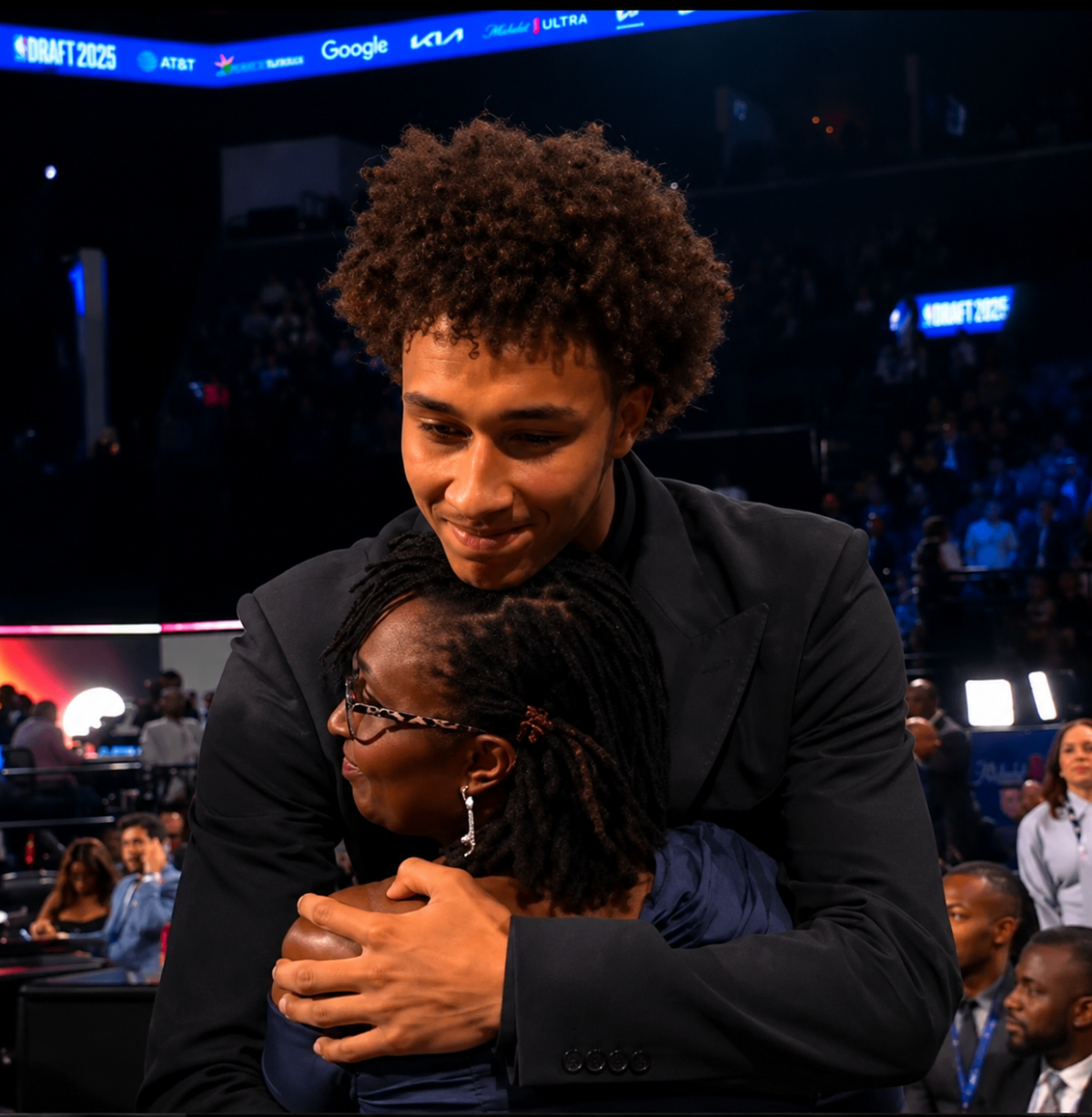 Rwandan-American forward Nate Ament's mother Godelive Mukankuranga congratulates her son after he was selected by the Miami Heat with the 13th overall pick in the 2026 NBA Draft, on Tuesday, June 23. 